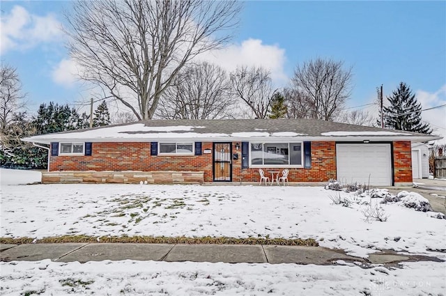 single story home featuring brick siding