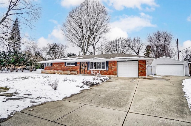 ranch-style home featuring a garage and brick siding