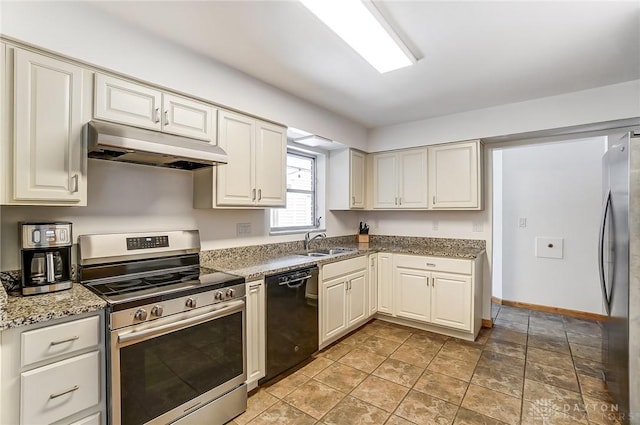 kitchen featuring under cabinet range hood, a sink, baseboards, appliances with stainless steel finishes, and light stone countertops