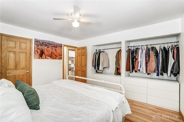 bedroom featuring ceiling fan and light wood-type flooring