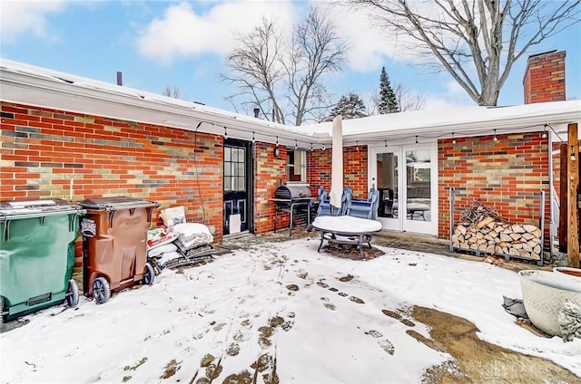 view of snow covered patio