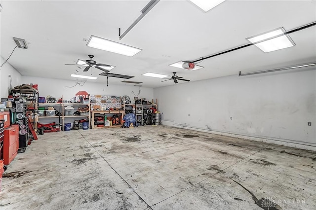 garage featuring a garage door opener, ceiling fan, and a workshop area