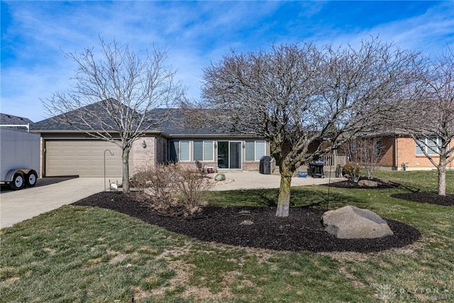 ranch-style home with driveway, a front lawn, and an attached garage