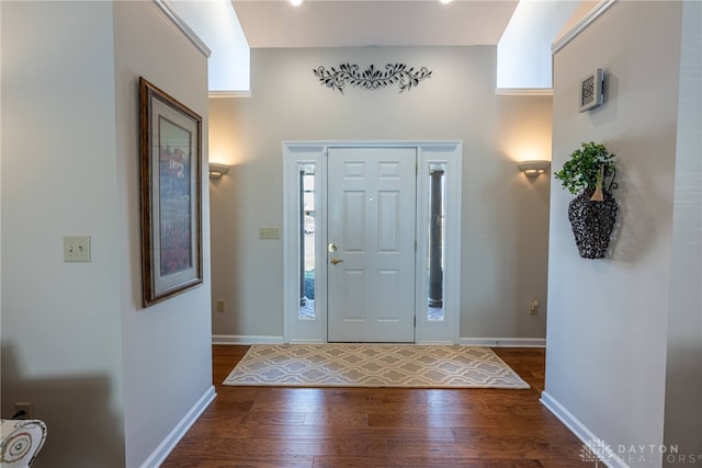 entrance foyer featuring wood finished floors and baseboards