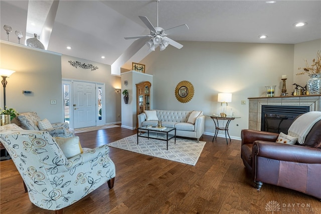 living room featuring recessed lighting, a fireplace, dark wood finished floors, and baseboards