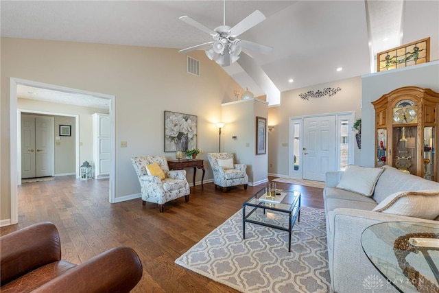 living room with high vaulted ceiling, visible vents, and dark wood finished floors