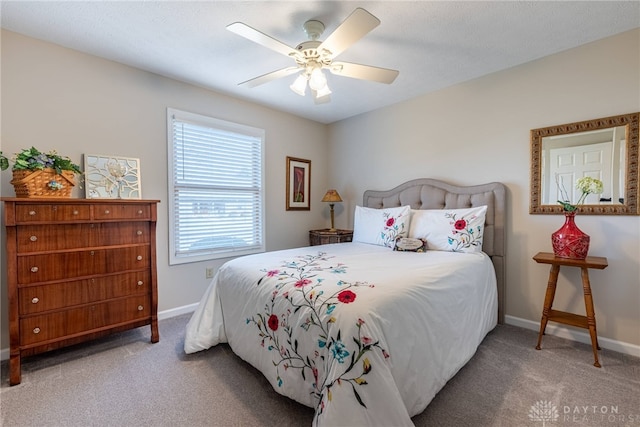 bedroom featuring carpet, a ceiling fan, and baseboards