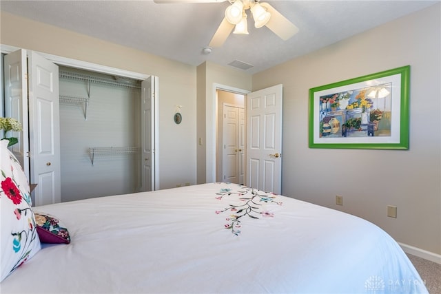 bedroom featuring carpet floors, a closet, visible vents, ceiling fan, and baseboards