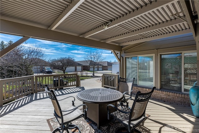 wooden terrace with a residential view, a fire pit, and a pergola