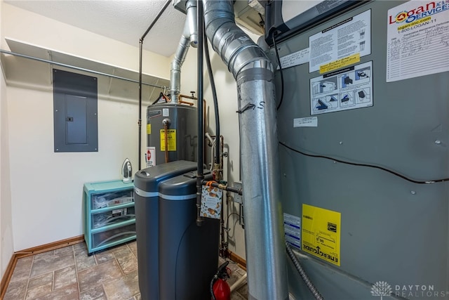 utilities featuring water heater, electric panel, and heating unit