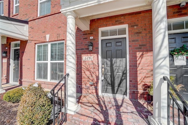 entrance to property with brick siding