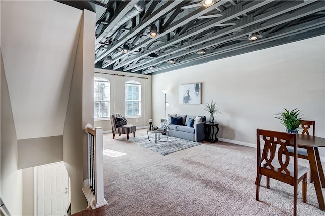 living room featuring carpet floors and baseboards