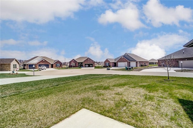 view of yard with driveway and a residential view