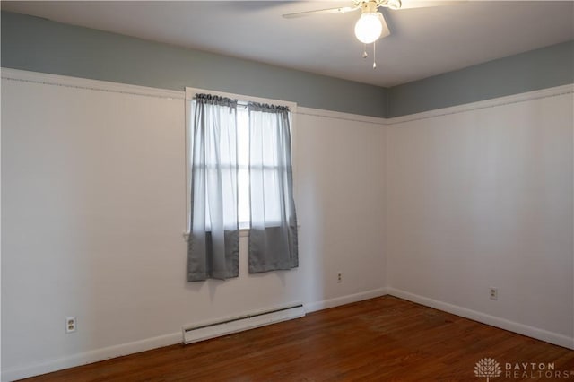 empty room with a baseboard radiator, wood finished floors, a ceiling fan, and baseboards