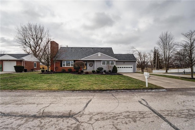 view of front of house with brick siding, concrete driveway, a front yard, a chimney, and an attached garage