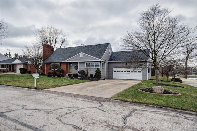 view of front facade featuring driveway, a front yard, a garage, brick siding, and a chimney