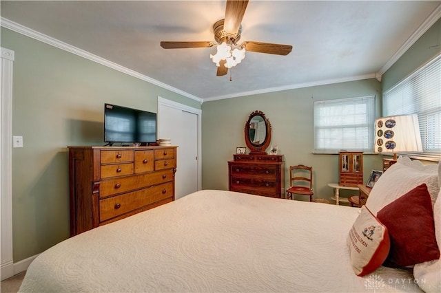 bedroom featuring baseboards, ceiling fan, and ornamental molding