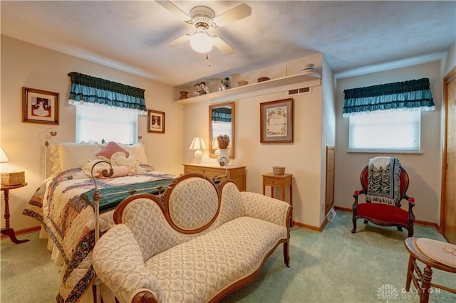 carpeted bedroom featuring ceiling fan and baseboards