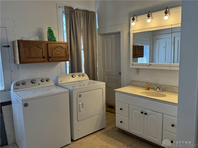 laundry room with laundry area, washer and clothes dryer, and a sink