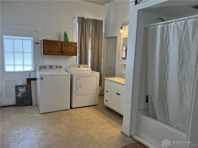 clothes washing area with washer and dryer and laundry area