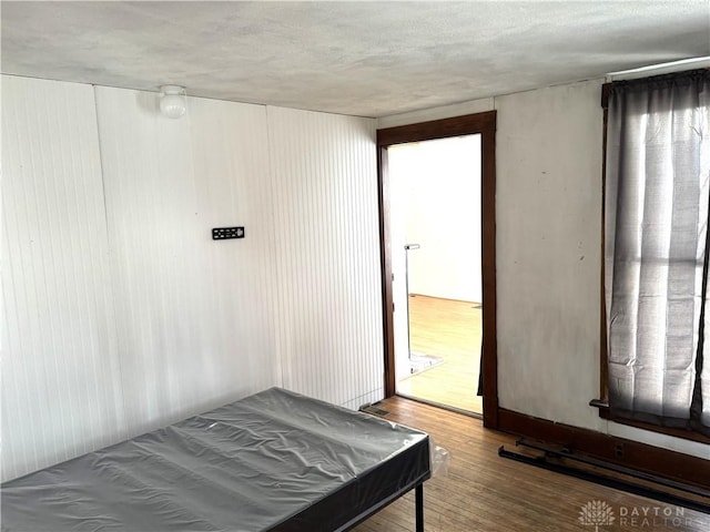 bedroom featuring wood finished floors