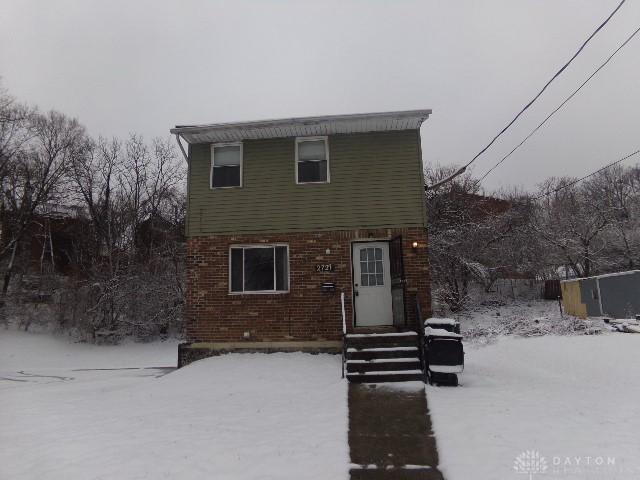 view of front of property featuring entry steps and brick siding