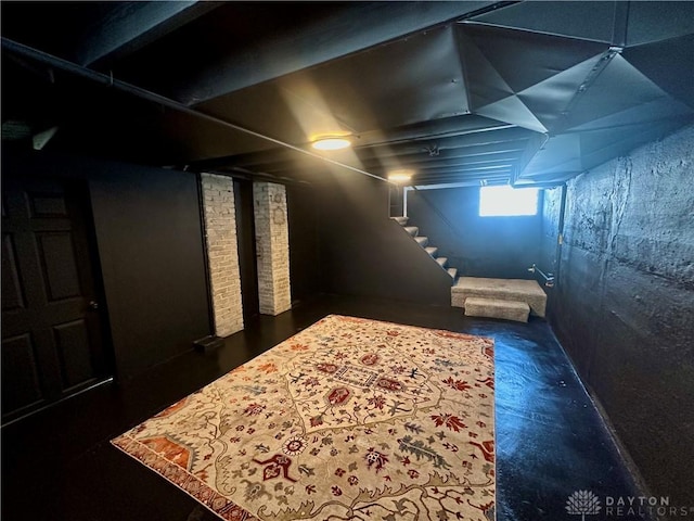basement featuring stairs