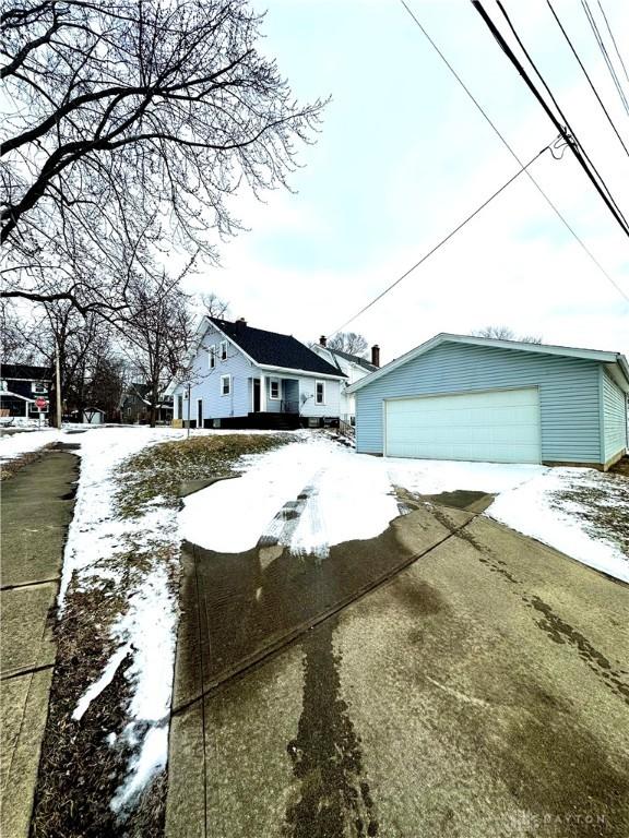 view of front of property with an outbuilding and a garage