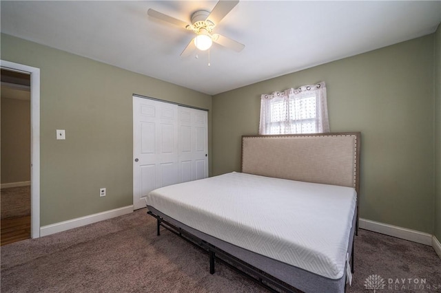 carpeted bedroom with baseboards, a closet, and ceiling fan