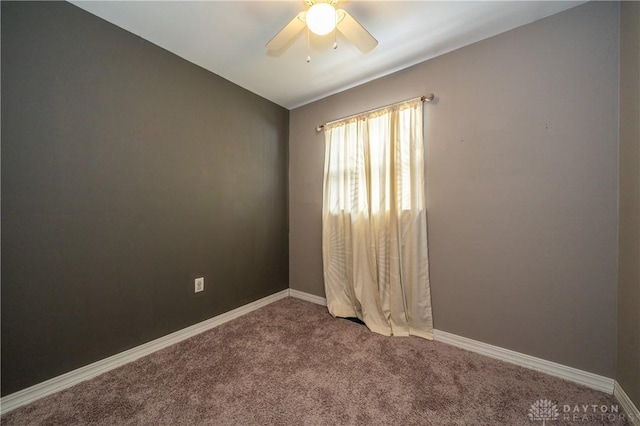 empty room with baseboards, carpet, and a ceiling fan