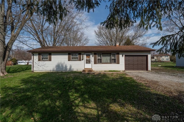 ranch-style home with dirt driveway, an attached garage, entry steps, and a front yard