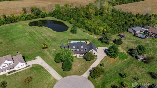 birds eye view of property with a water view