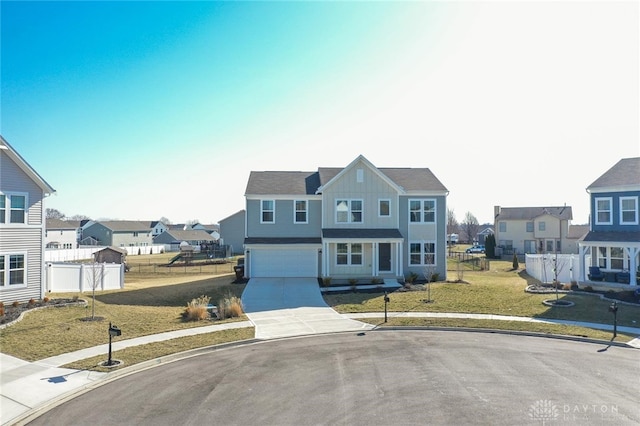 view of front of property with board and batten siding, fence, a residential view, a garage, and driveway