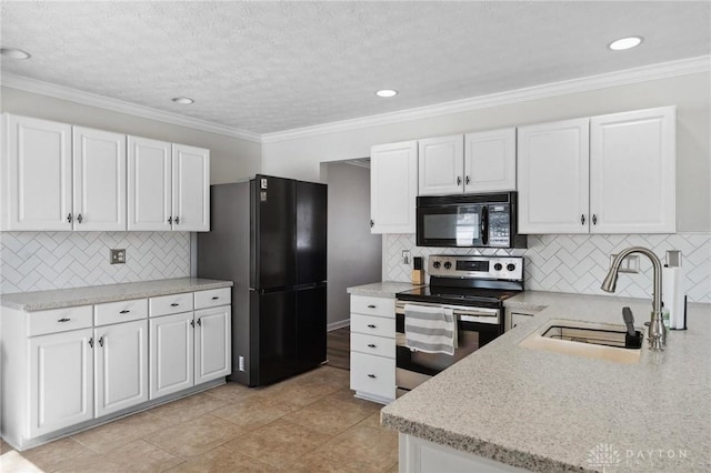 kitchen with light stone counters, crown molding, black appliances, white cabinetry, and a sink