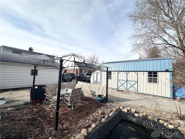 view of yard featuring a shed and an outbuilding