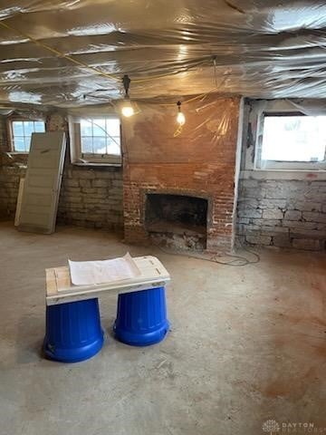 basement featuring a healthy amount of sunlight and a fireplace