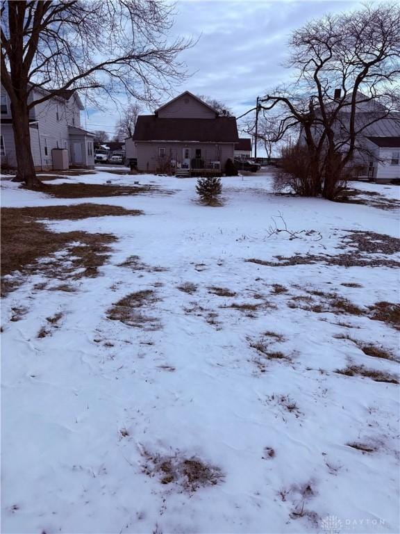 view of yard layered in snow