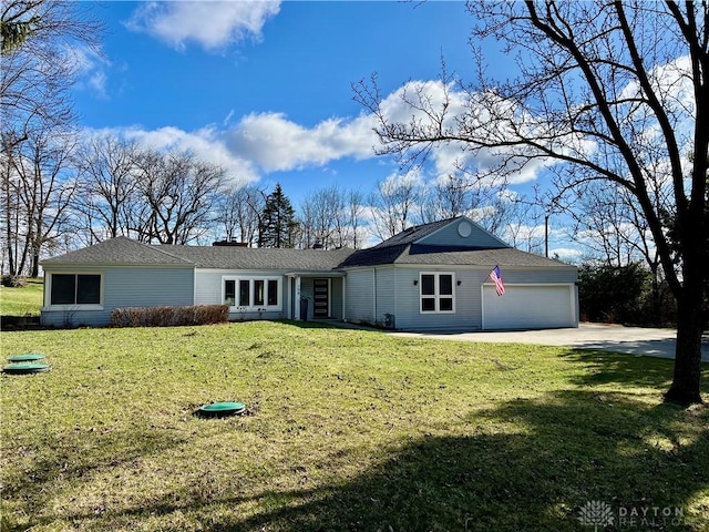 ranch-style house featuring a front lawn, an attached garage, concrete driveway, and a chimney