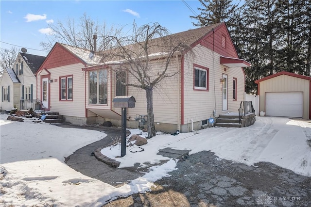 view of front of house featuring a garage and an outdoor structure