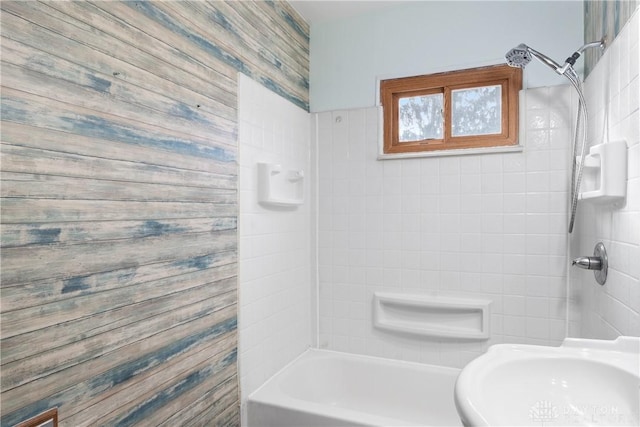 bathroom featuring shower / bathtub combination and a sink