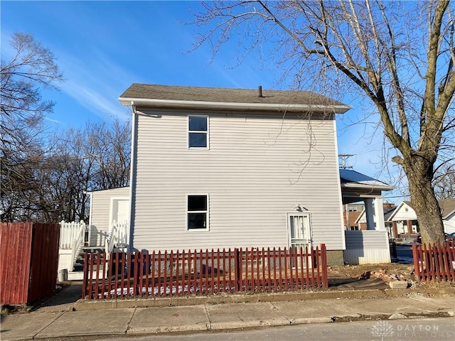 view of side of property with fence