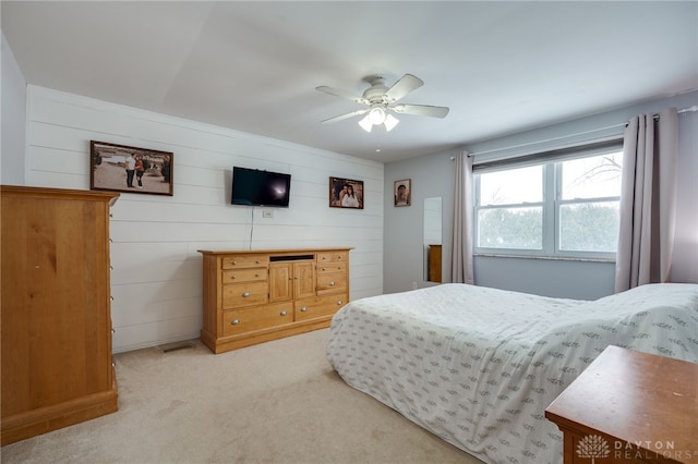 carpeted bedroom with a ceiling fan