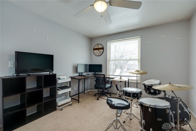 carpeted office with baseboards and ceiling fan