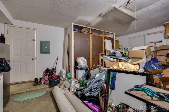 interior space featuring electric panel and a textured ceiling