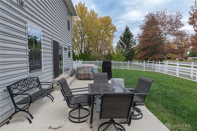 view of patio / terrace featuring outdoor dining area and a fenced backyard