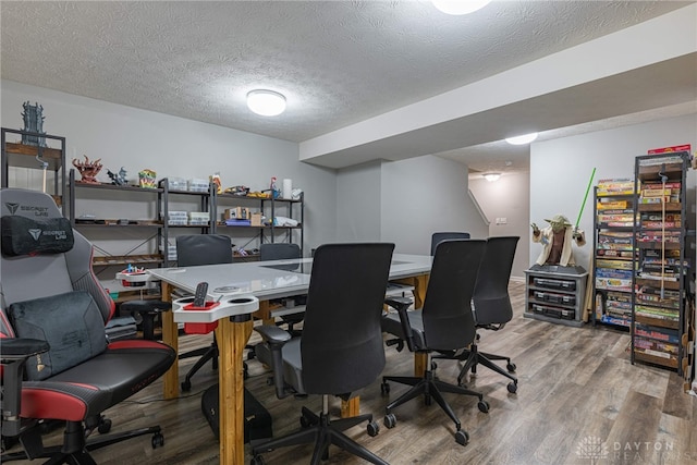 office area featuring a textured ceiling and light wood finished floors