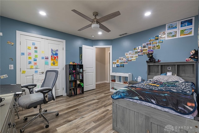 bedroom with recessed lighting, visible vents, ceiling fan, and wood finished floors