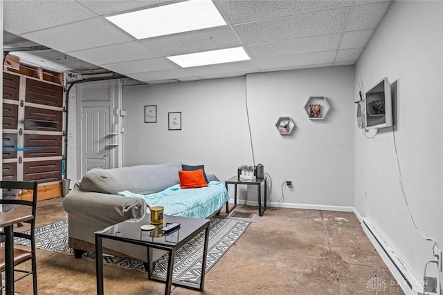 310 E Maple Ave, Miamisburg, OH 45342 - living room featuring a baseboard radiator, a paneled ceiling, and baseboards