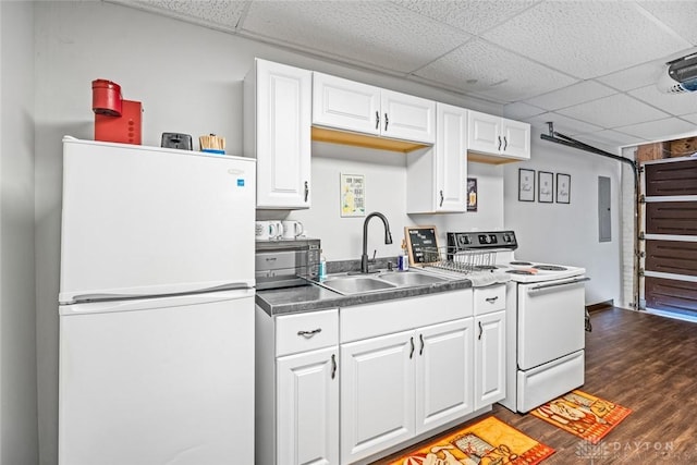 310 E Maple Ave, Miamisburg, OH 45342 - kitchen with white appliances, a sink, a drop ceiling, dark wood-style flooring, and white cabinetry