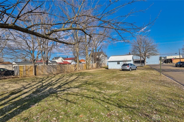 view of yard featuring a residential view and fence